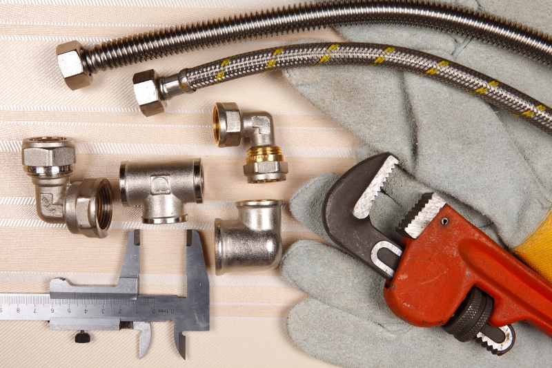 Plumber working on pipes in a Bloomsbury home